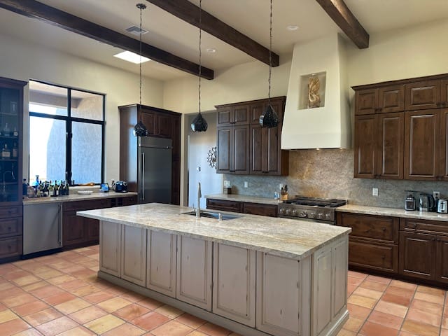 Spacious modern kitchen with large island and wood cabinets